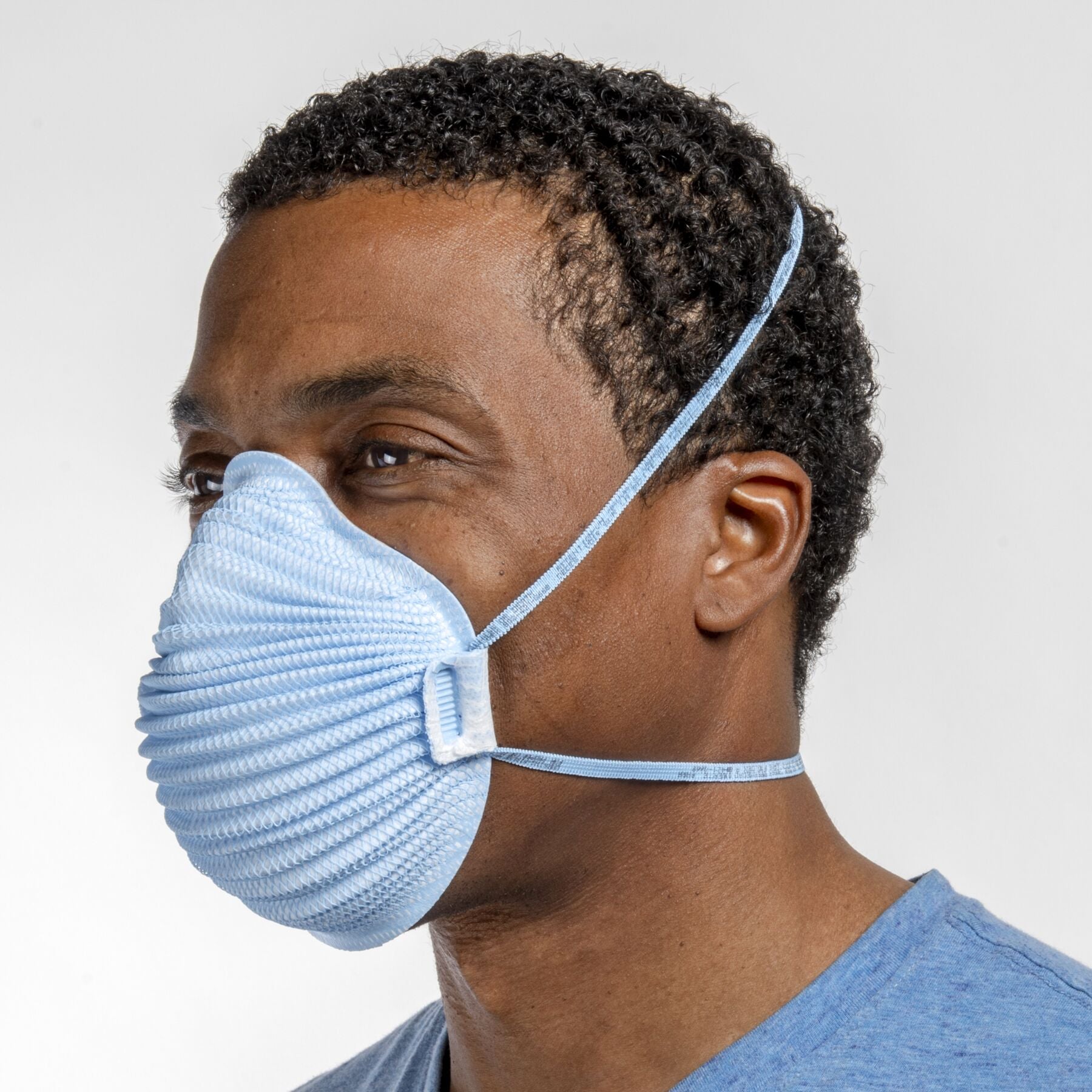 Man in health care wearing medium large blue Airwave 4650 NIOSH N95 surgical respirator from Canada Strong Masks.