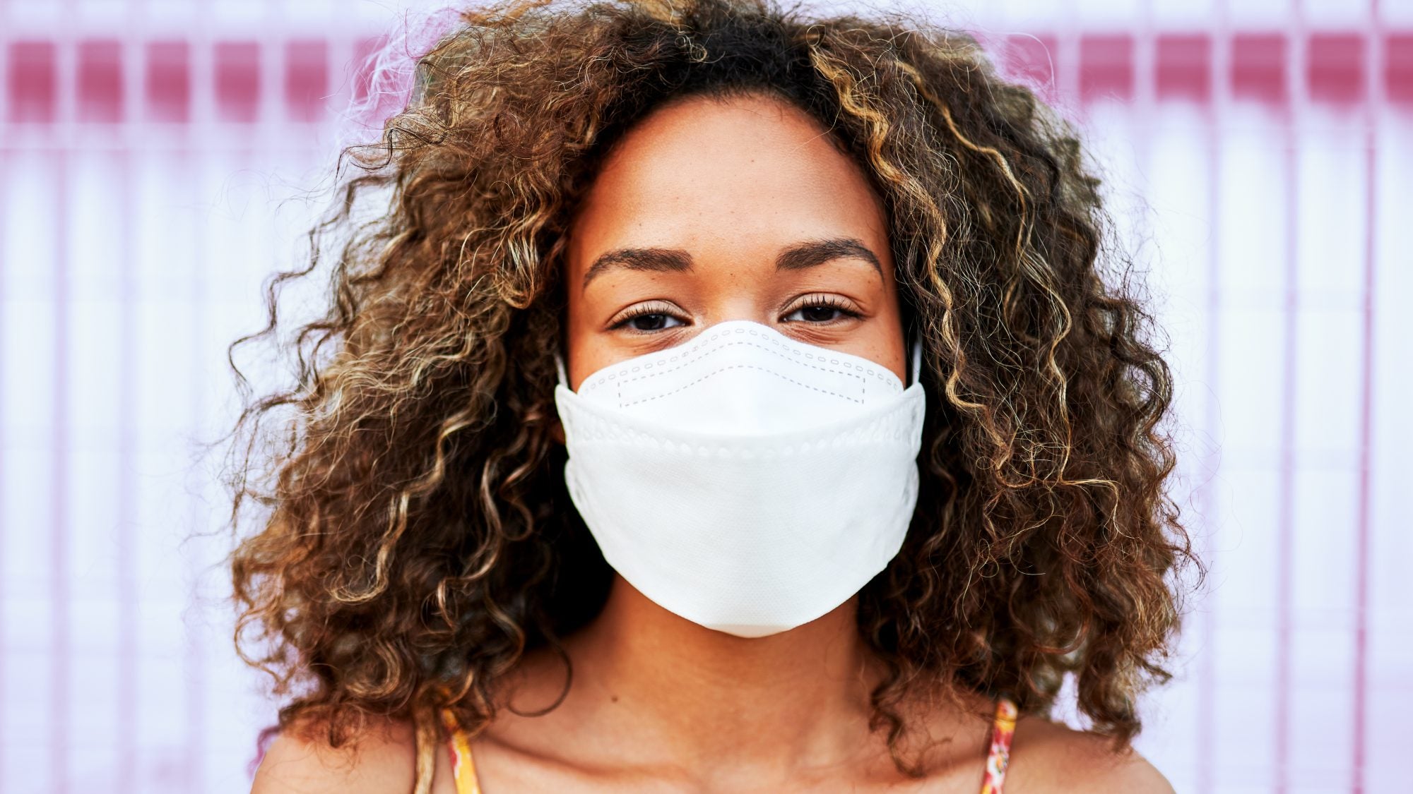 Woman wearing white CA-N95 medium respirator mask made in Canada