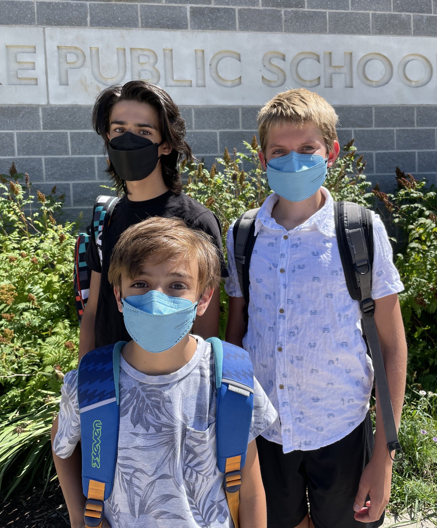 School Kids wearing blue and black KN95 N95 respirator face masks made in Canada