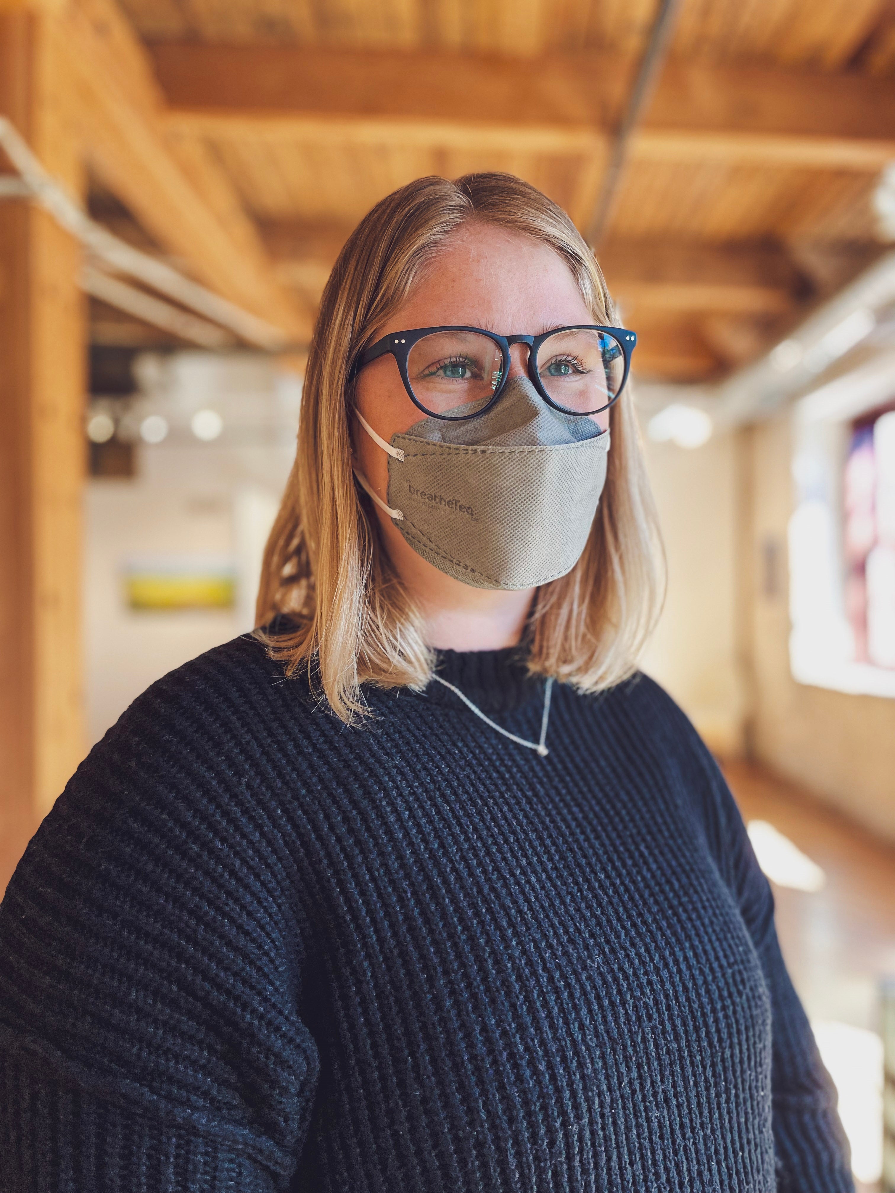 Woman wearing BreatheTeq KN95 medium grey Canada Masq respirator mask made in canada