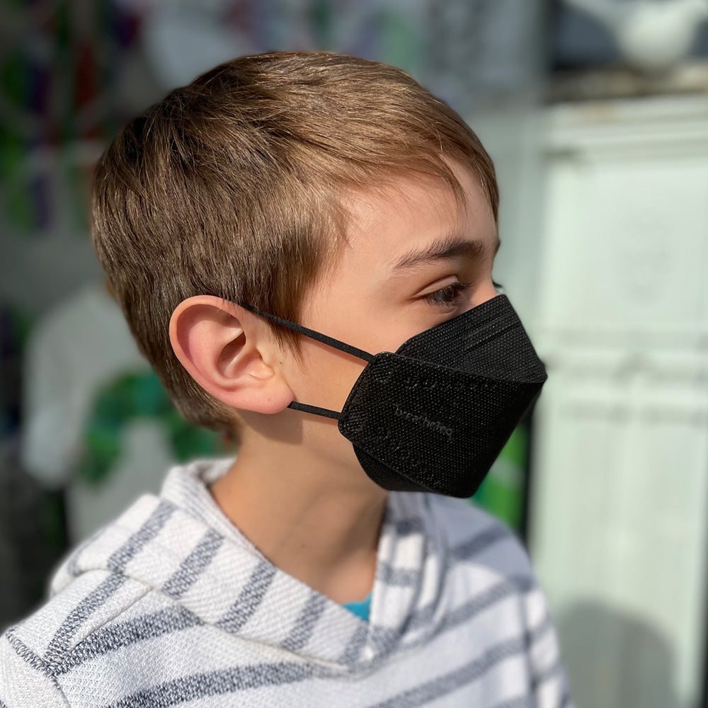 child young Canadian boy wearing black xs extra small kids BreatheTeq KN95 face mask for school