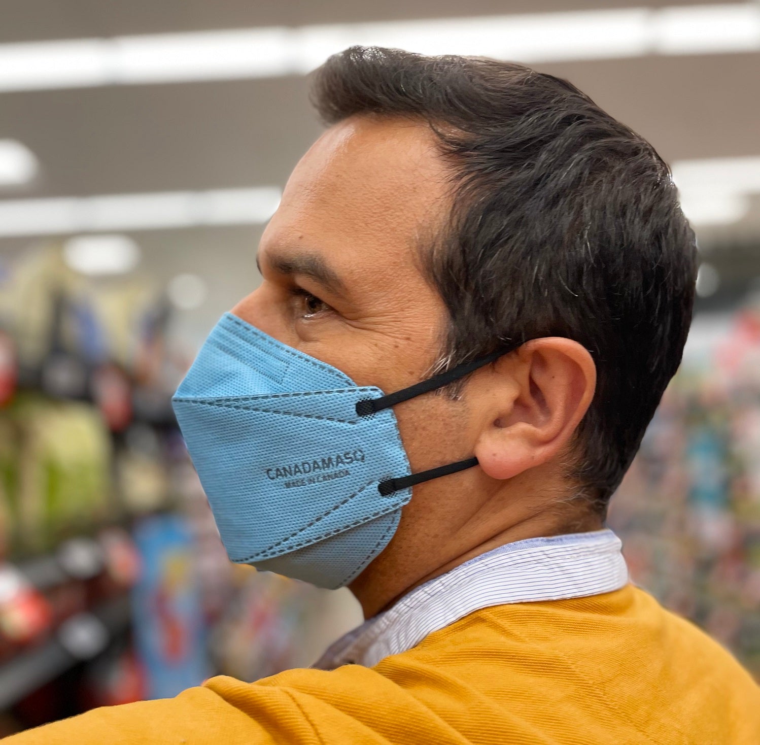 Man wearing Large Canada Masq blue and black CA-N95 respirator mask from Canada Strong