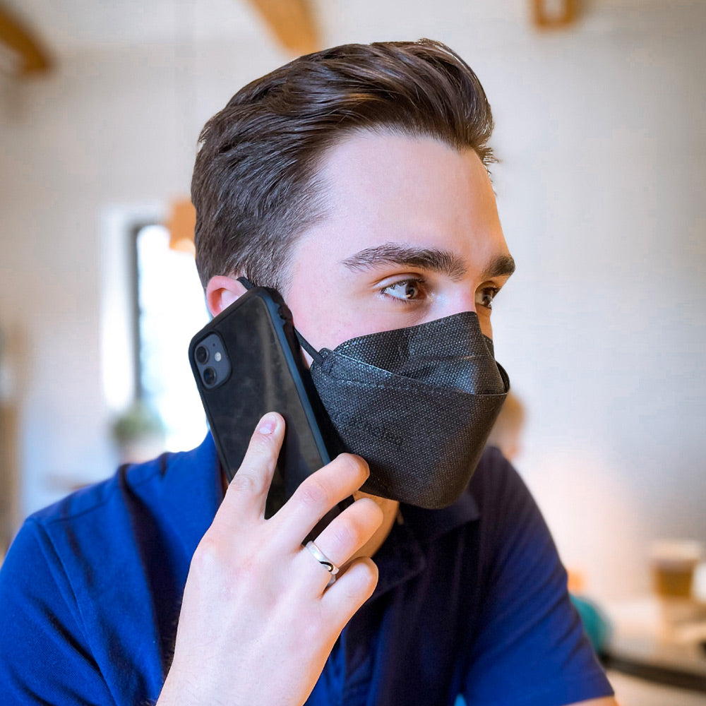 business man work in office wearing black Canadian KN95 mask breatheTeq